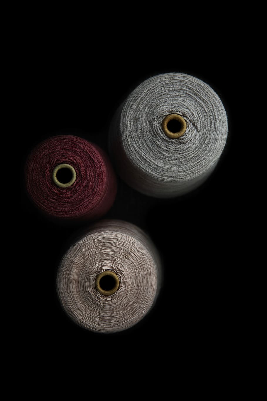 three assorted-color thread rolls, top view photography of three threads HD wallpaper