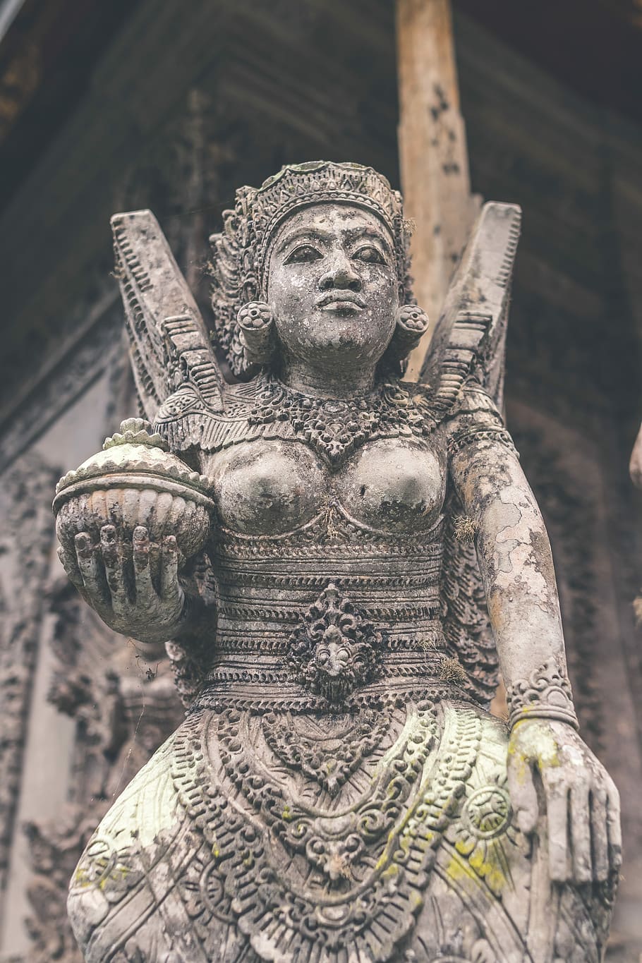 Hindu stone statue in the balinese temple, woman statue, concrete HD wallpaper