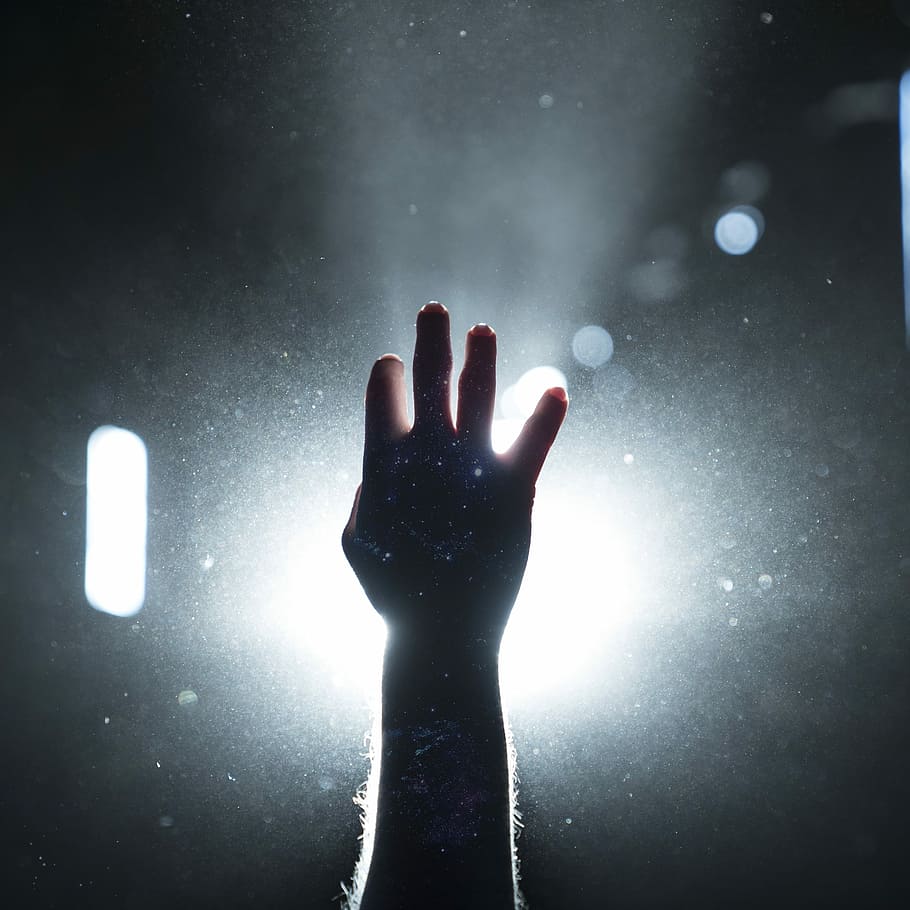 person's hand on light, human's hand raising hands, lights, silhouette HD wallpaper
