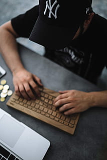 Young man typing on the wooden keyboard, workspace, workplace HD wallpaper