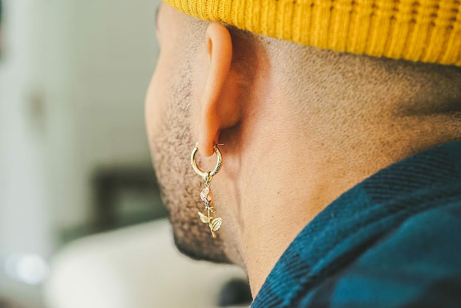 Men wearing dangling on sale earrings