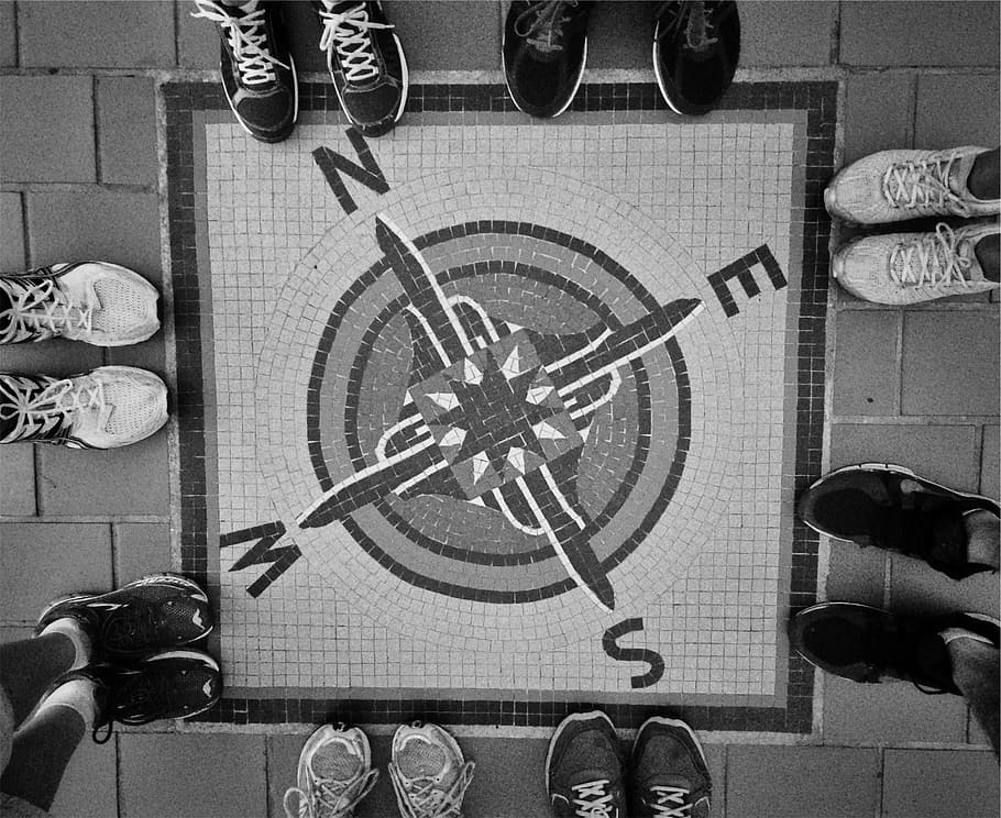 road painted with square compass surrounded by group of people wearing sneakers HD wallpaper