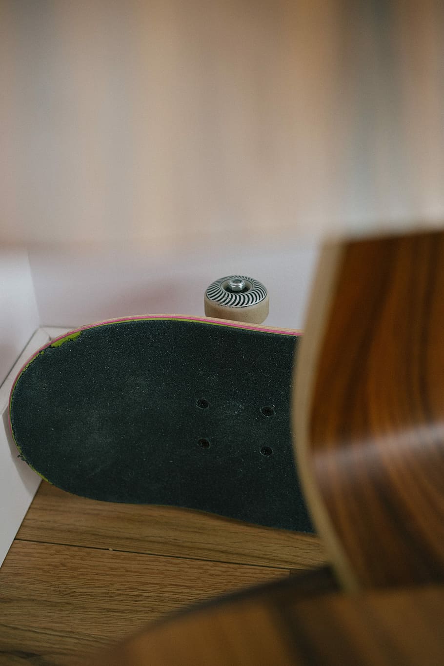 black wooden skateboard on floor, black skateboard, wheel, wall HD wallpaper