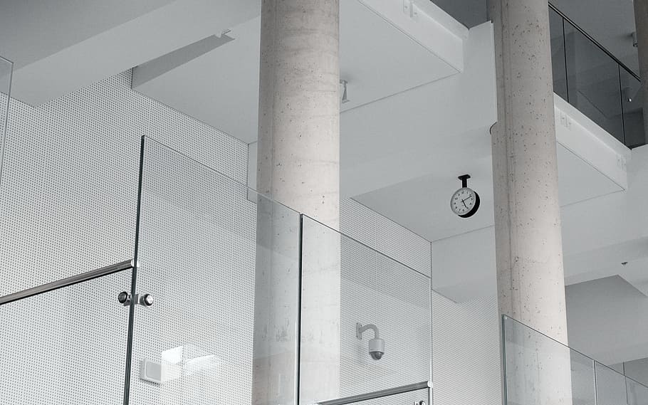 black and white CCTV camera mounted on white wall, clear glass wall HD wallpaper