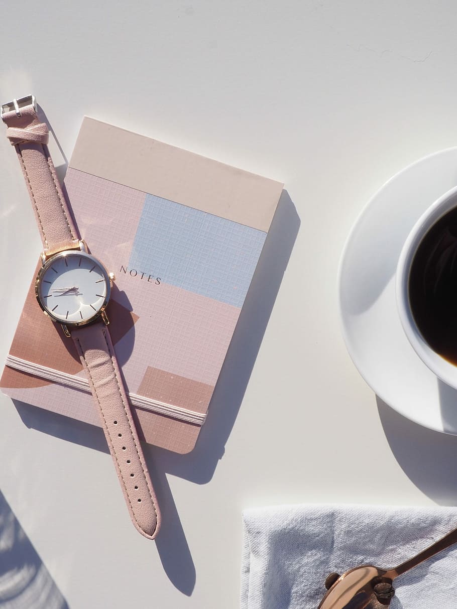 watch at 8:45, person taking photo of round white analog watch on notes box HD wallpaper