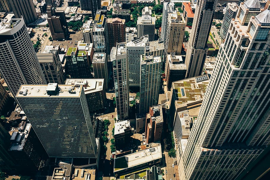 aerial photo of gray concrete city buildings during daytime HD wallpaper