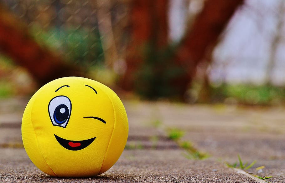 HD wallpaper: emoji plush toy on ground, smiley, wink, funny, yellow, sweet  | Wallpaper Flare