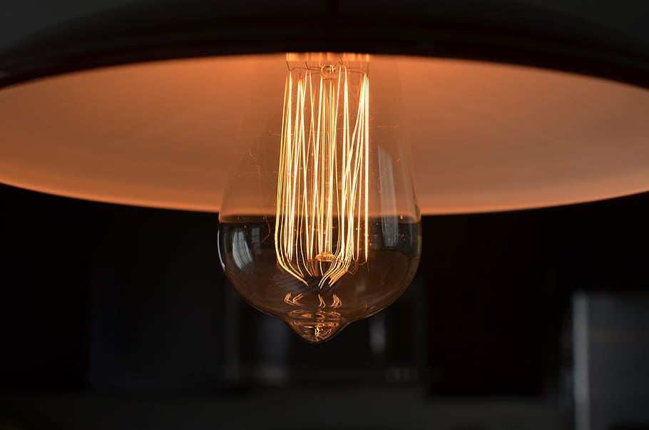 closeup photograph of light bulb, close-up photo of orange light bulb HD wallpaper