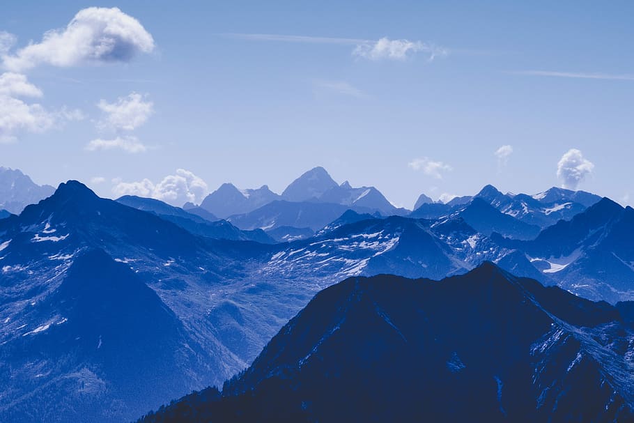 mountain rage view under blue sky during daytime, aerial view of black and blue mountain HD wallpaper