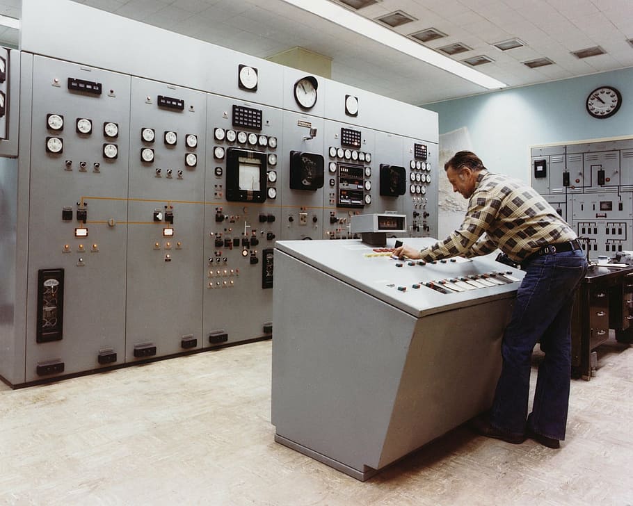 person operating industrial machine, control room, power plant