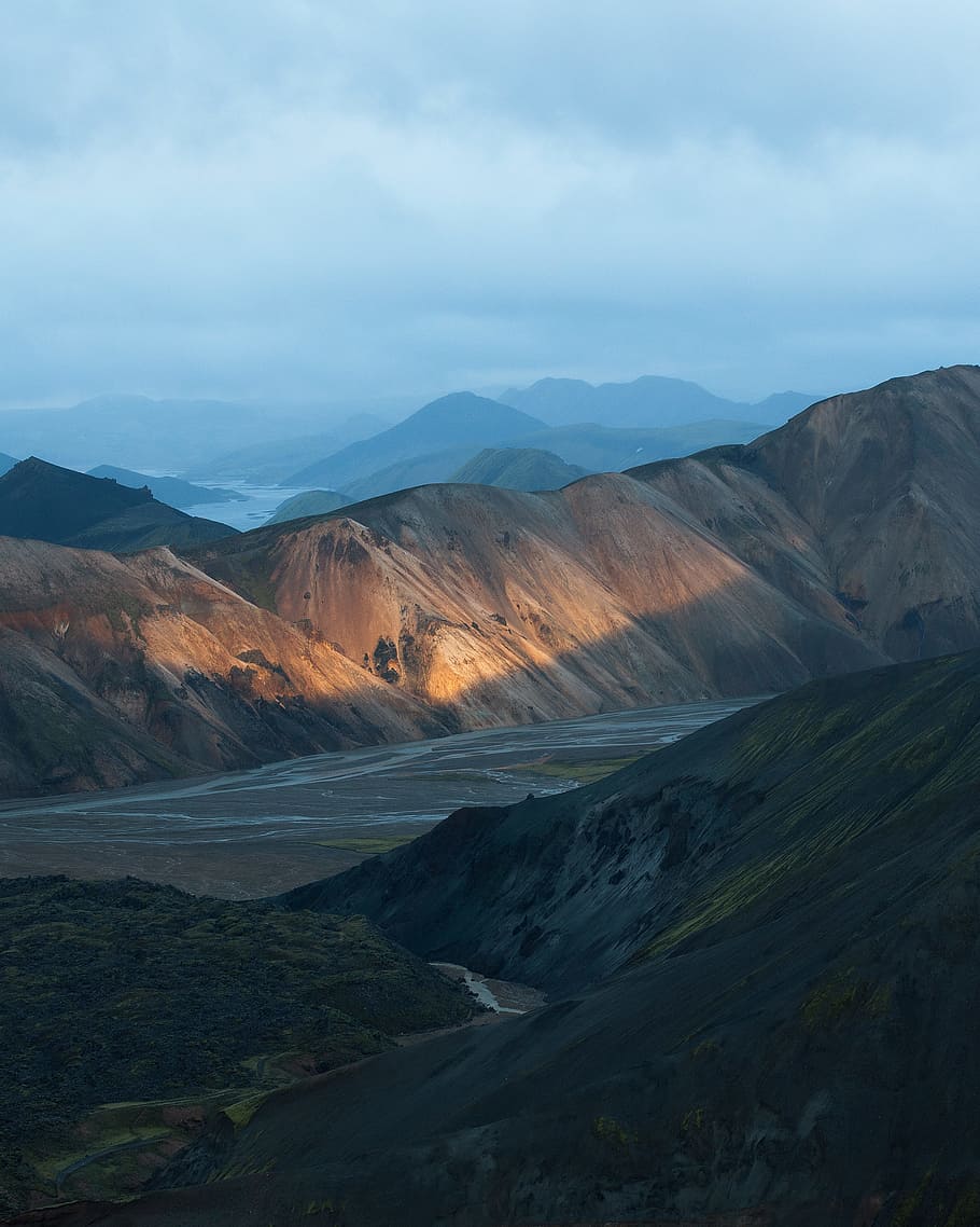 aerial photo of brown hills, aerial photography of brown mountain under cloudy sky HD wallpaper