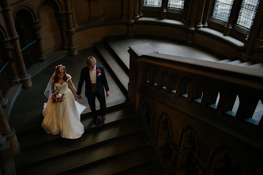Wedding, couple holding hands walking on stair inside building HD wallpaper