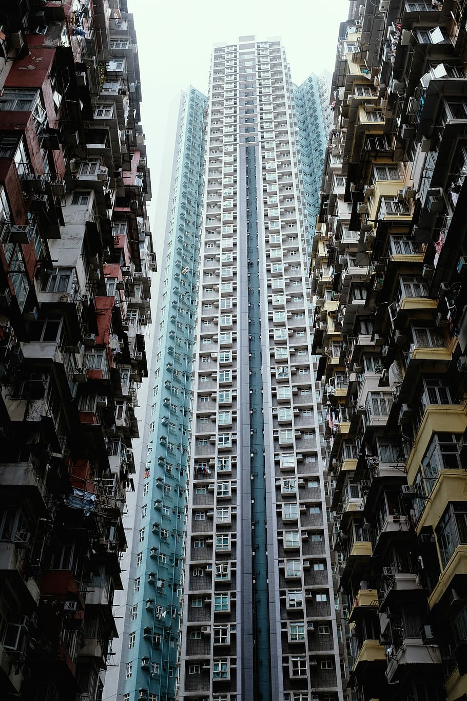 blue and white concrete building, low-angle photography of building HD wallpaper