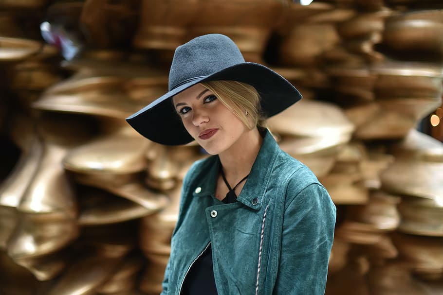 woman in black cowboy hat and green collared jacket outdoor during daytime HD wallpaper