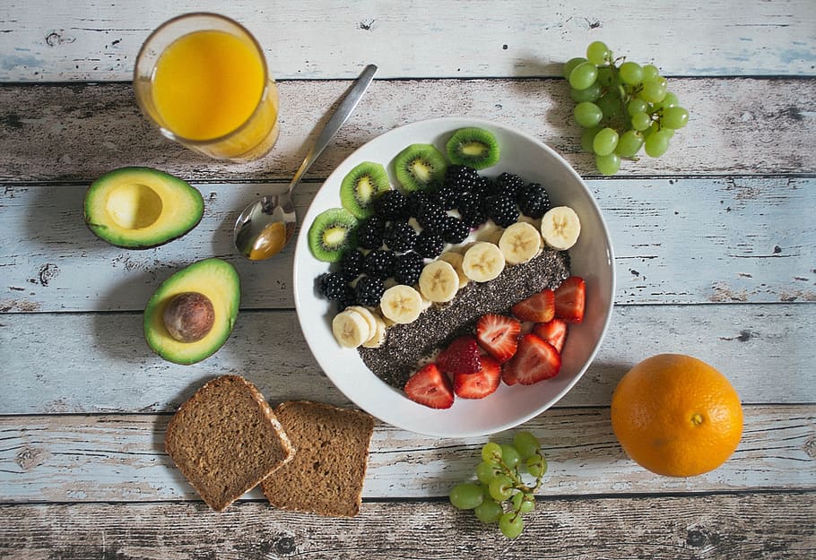fruit lot on ceramic plate, sliced fruits on plate, table, breakfast HD wallpaper