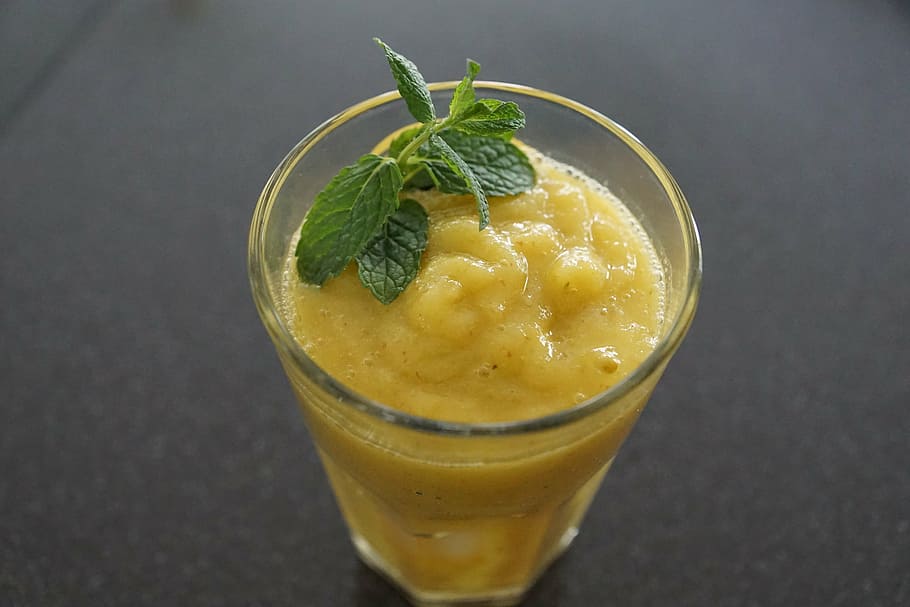 fruit shake in glass with green leaf garnish, smoothie, mango HD wallpaper