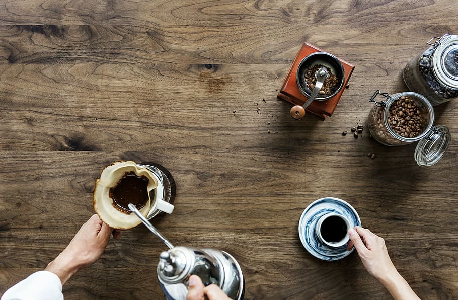 two person holding cups filled with coffee on table, mug, caffeine HD wallpaper