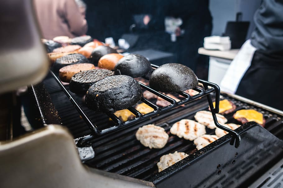 Toasting squid ink black burger buns, cooking, grilling, outside HD wallpaper