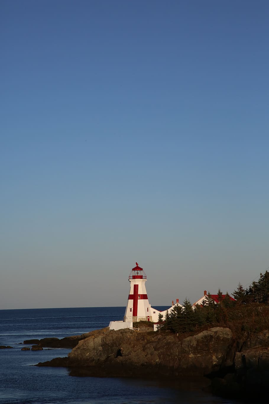lighthouse, canada, evening, sea, water, rock, coastal, sky HD wallpaper