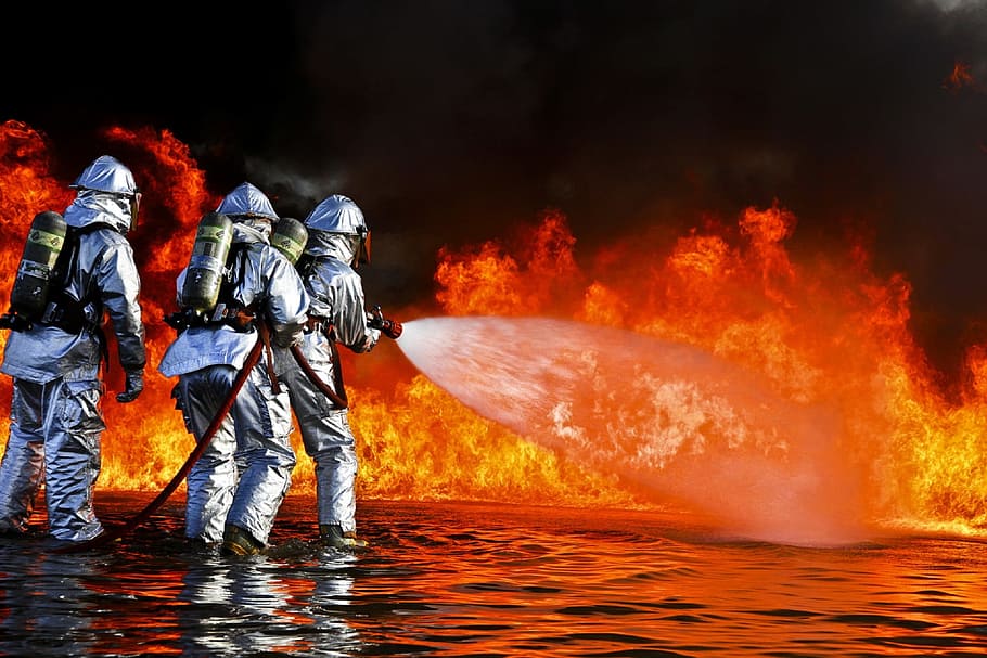 three firefighters pointing water hose on flame, training, live, HD wallpaper