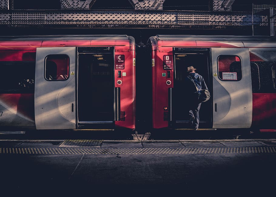 man about to go inside the train, person riding red train, station HD wallpaper