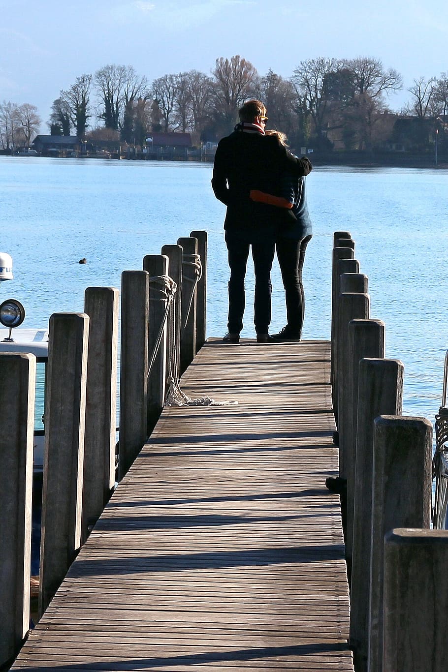 man hand over woman's shoulder standing on dock facing body of water, HD wallpaper