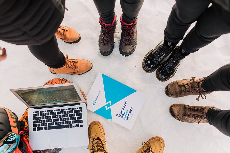 photo of people wearing boots, six person forming circle standing on concrete surface HD wallpaper