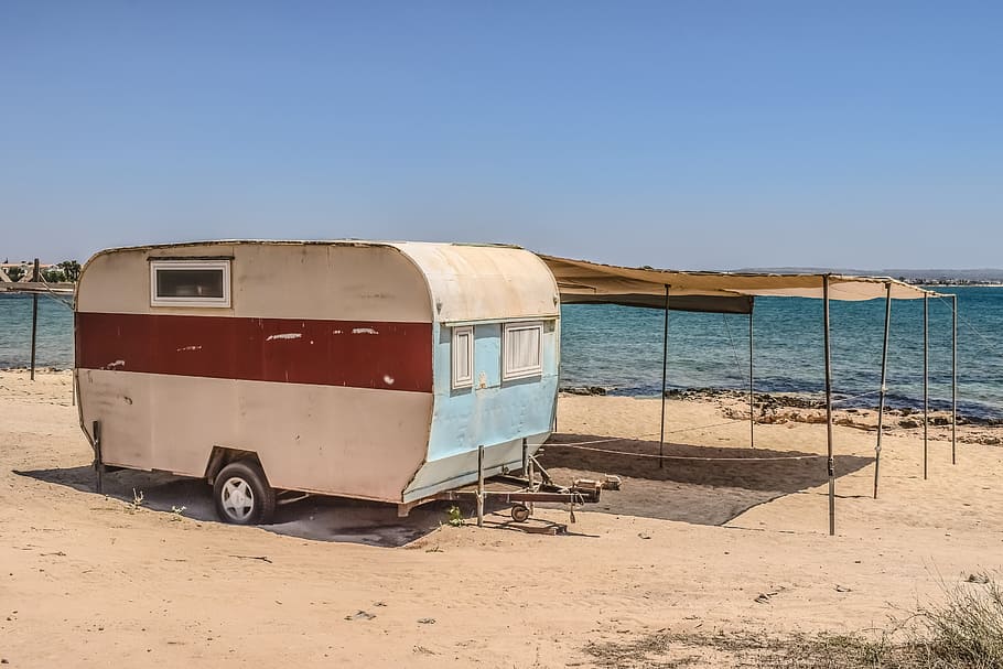 caravan, trailer, shed, improvised, wooden, decaying, beach