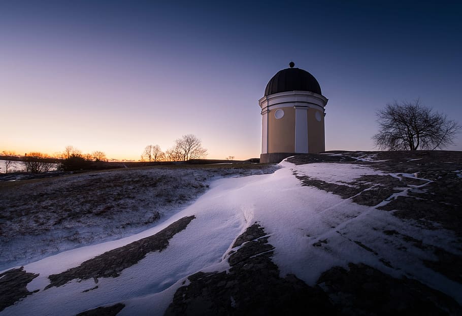 yellow and white painted tower near snowy field, architectural photography of brown and black house HD wallpaper
