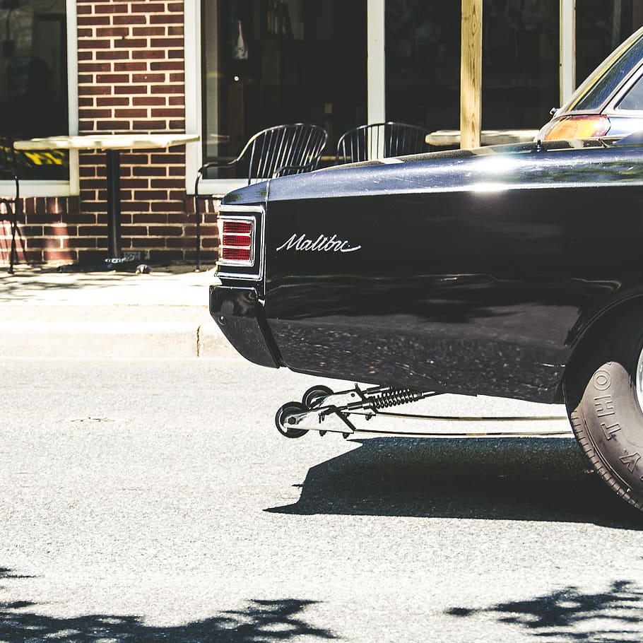 classic Chevrolet Malibu with chrome tailpipe park by the cafe, black Chevrolet Malibu HD wallpaper