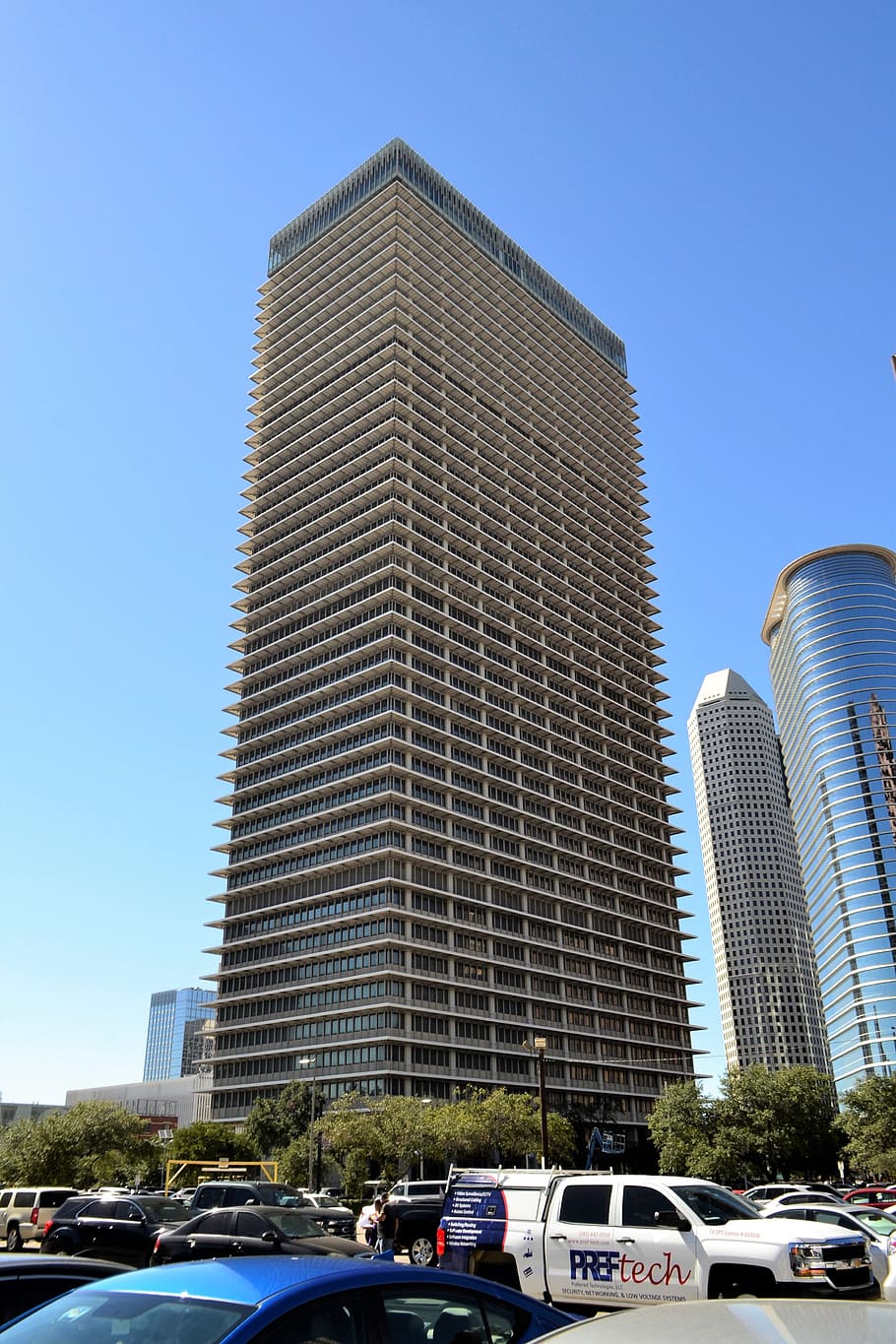 skyscraper, houston, texas, office building, parked cars, parking lot