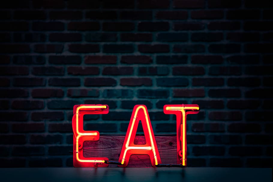 EAT LED signage, EAT neon light signage turned on, text, word
