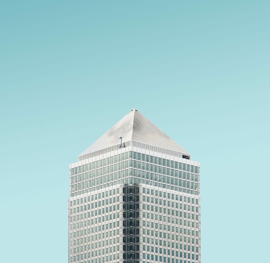 white concrete building under blue sky during daytime, architectural photography of gray high-rise building HD wallpaper