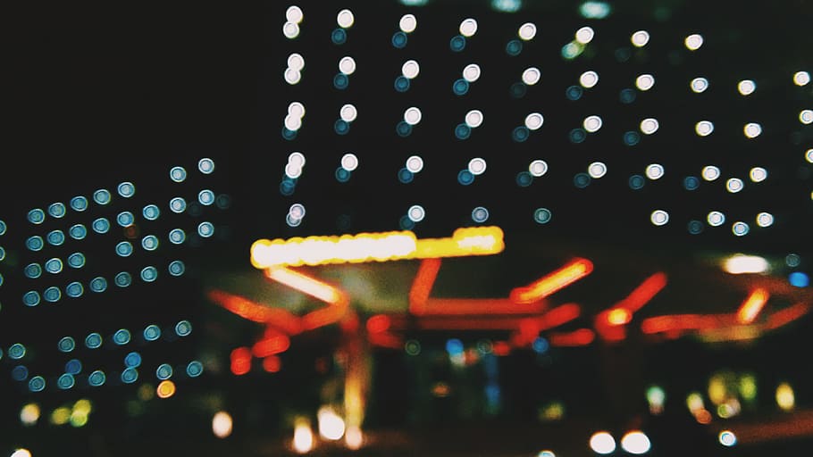 The bokeh created from neon lights, photo of bokeh lights, high rise building HD wallpaper