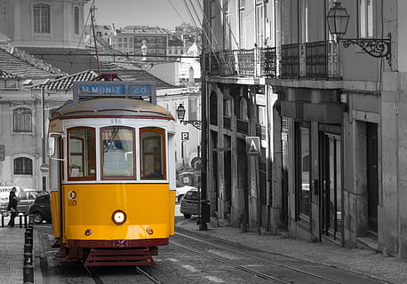 selective color photography of train in between building, lisbon HD wallpaper