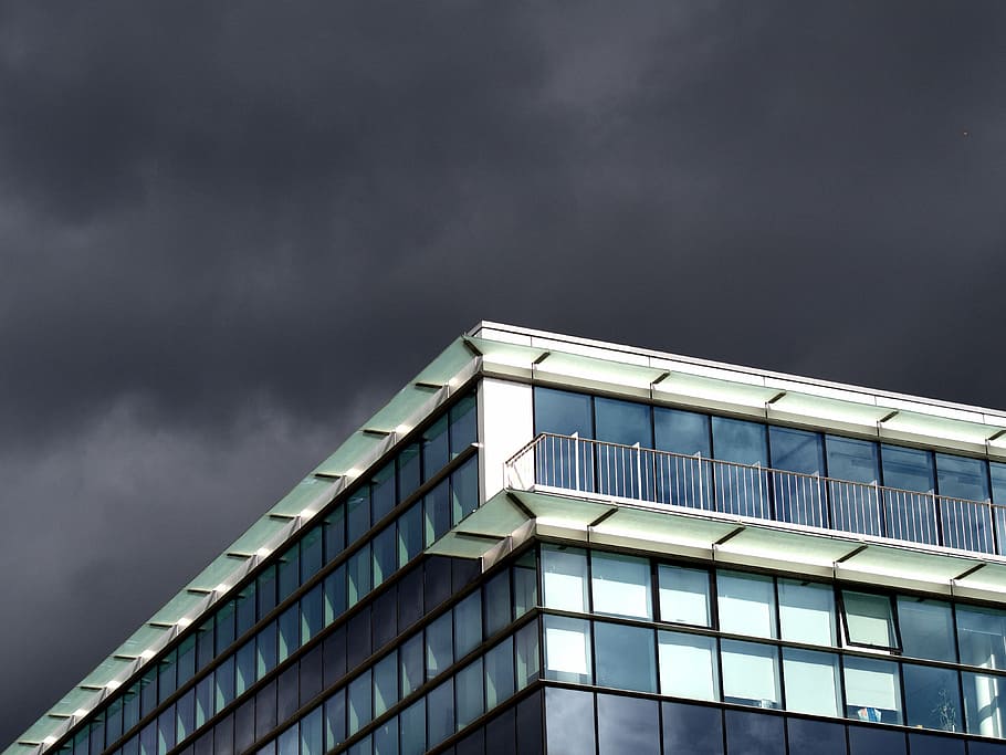 glass windowed building under gray sky during daytime, white HD wallpaper