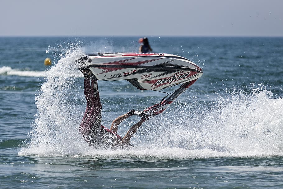 person riding personal watercraft doing acrobat on body of water during daytime, person doing vertical flip while riding personal water craft, HD wallpaper