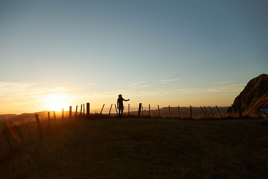 person, human, standing, pointing, silhouette, sunset, backlit HD wallpaper