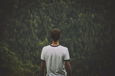selective focus photography of man wearing white crew-neck t-shirt HD wallpaper