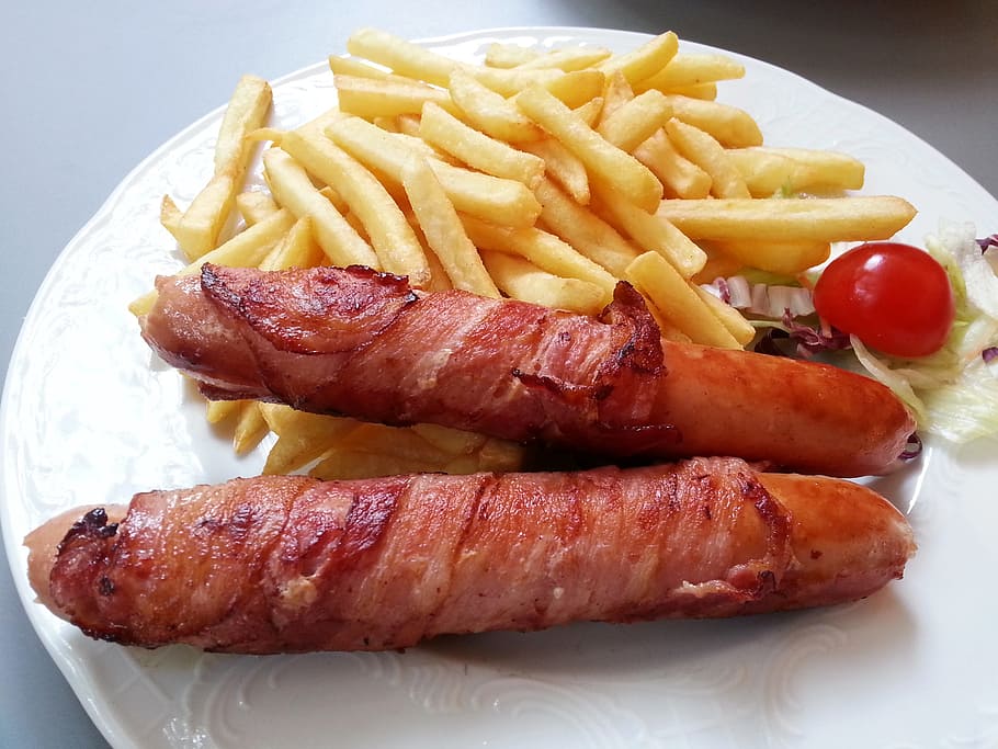 bacon wrapped sausages and fries on plate, Austria, French-Fried
