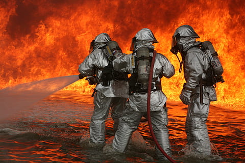 three firefighter holding hose in front of blazing fires, training HD wallpaper