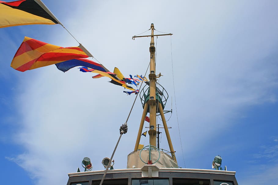 flags on tugboat, old, display, mast, lines, flying, colourful