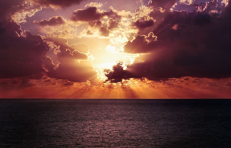 photo of a body of water and sunrise, calm sea under golden sky HD wallpaper
