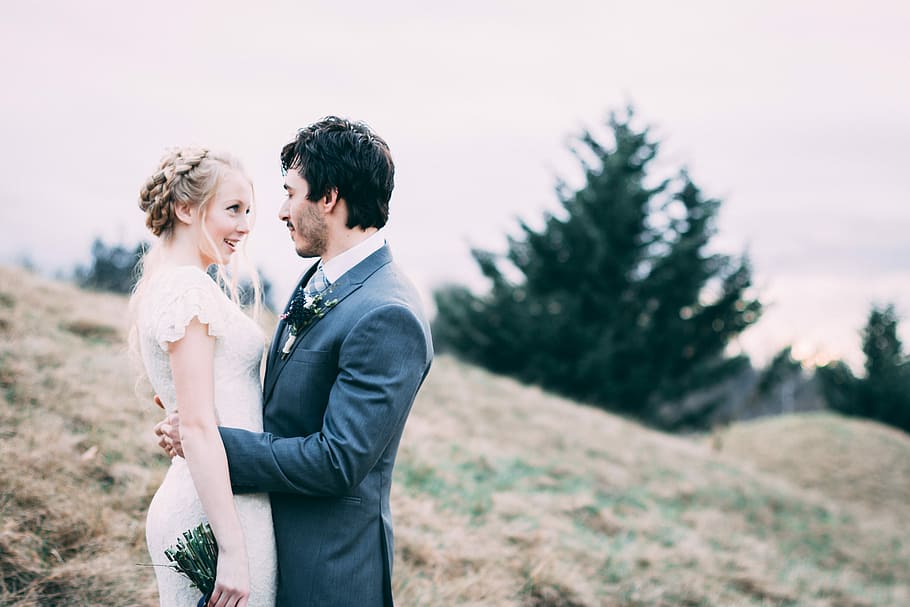 couple standing on hill during daytime, newlywed couple on green grass field HD wallpaper