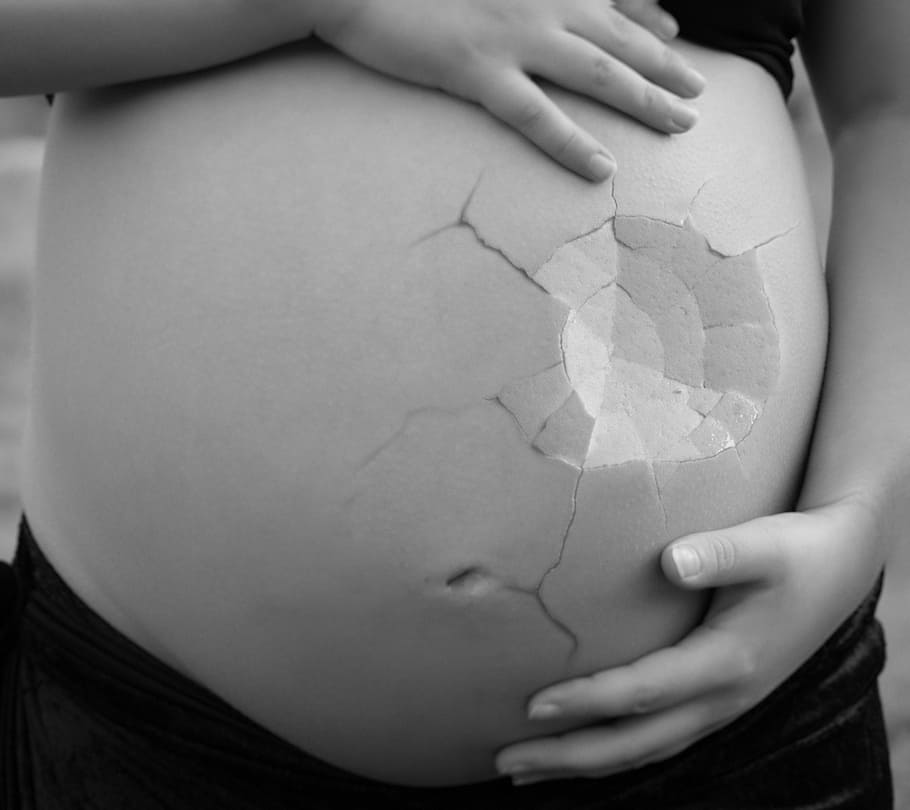 woman holding her tummy, pregnant, girl, stomach, crushed, health