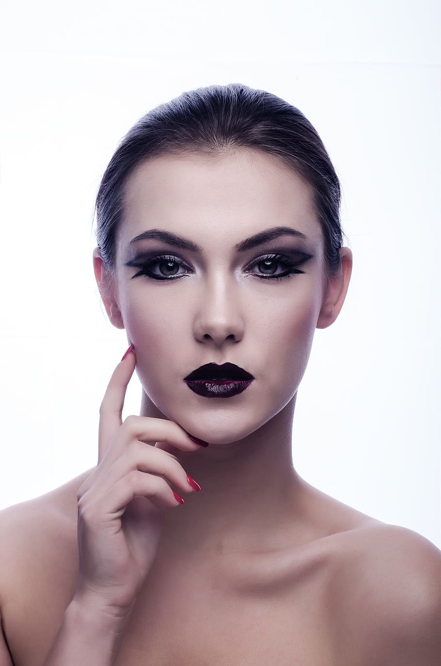 woman wearing black lipstick, black eyeshadow, and black mascara posing in front of white background HD wallpaper