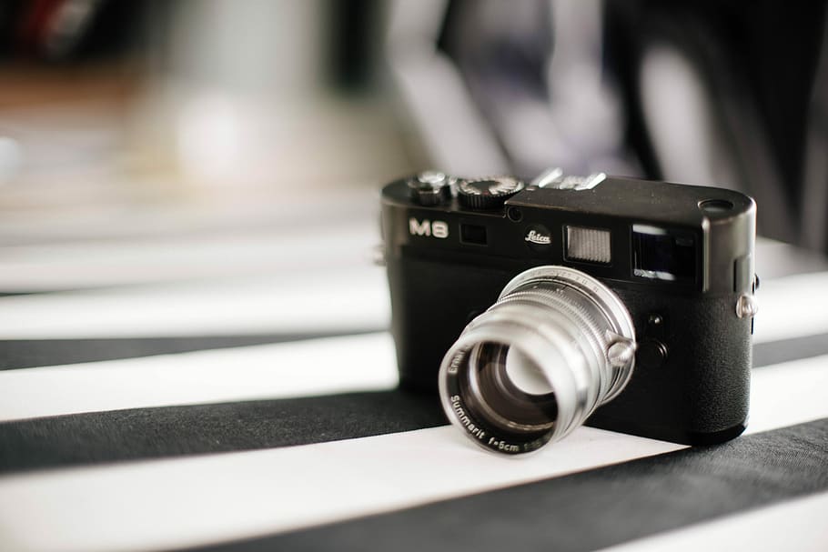 camera on white and black striped fabric cover, black SLR camera HD wallpaper