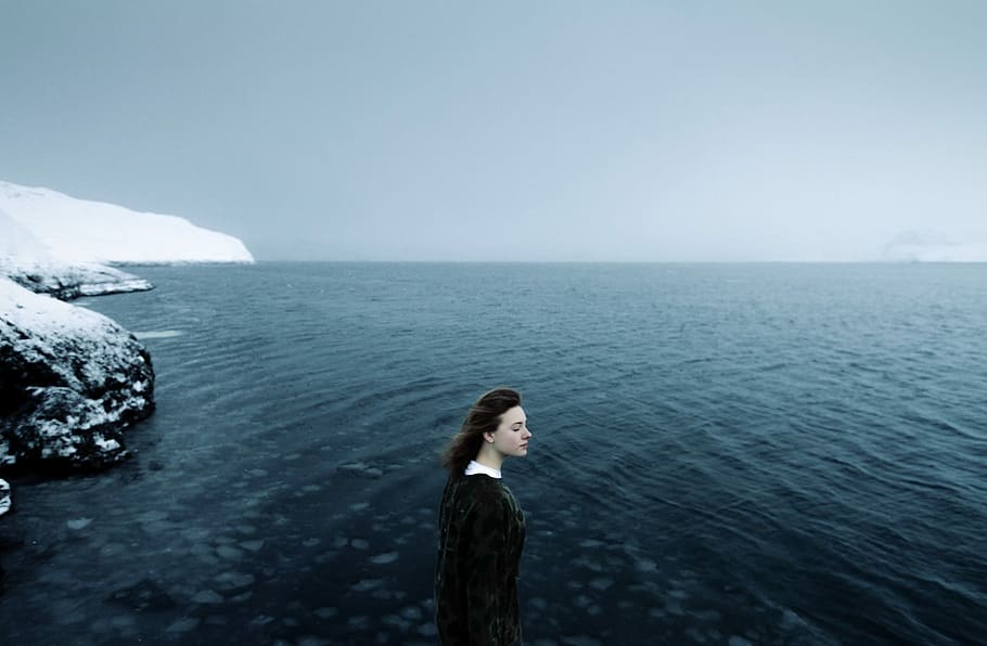 girl in black dress standing on sea shore filled with snow, nature HD wallpaper