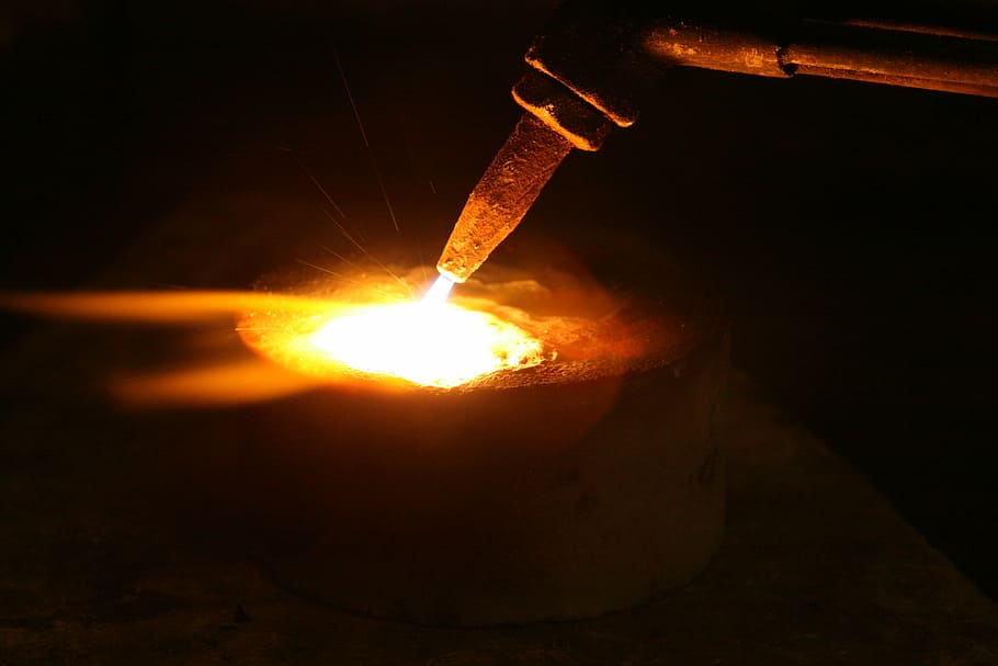 cutting torch against black background, acetylene, aluminium