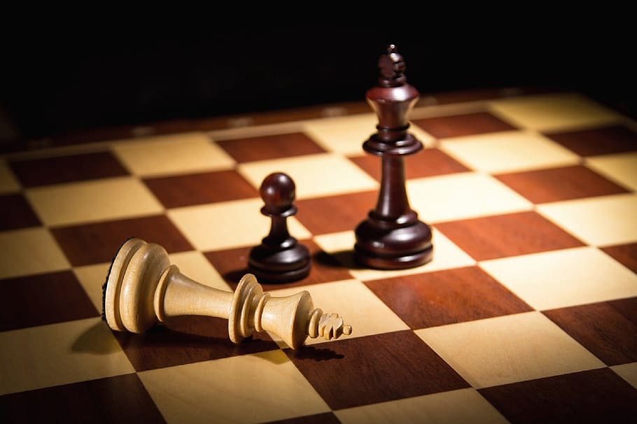 photo of brown chess pawn on chess board, king, mat, checkerboard